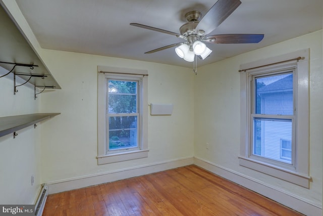 12 W Mispillion St, Harrington, DE 19952 - unfurnished room with light wood-type flooring, baseboards, a ceiling fan, and a baseboard radiator