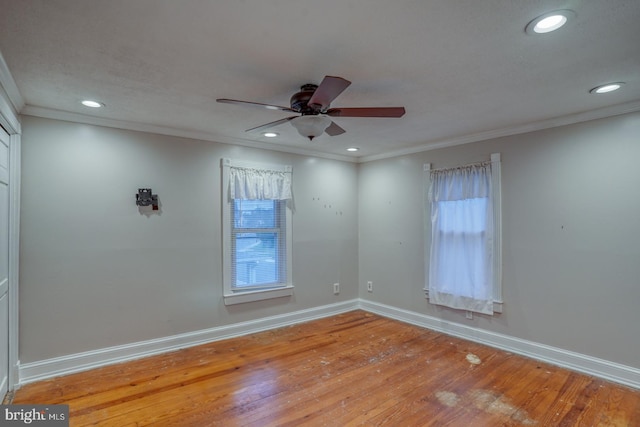 12 W Mispillion St, Harrington, DE 19952 - unfurnished room featuring baseboards, wood finished floors, recessed lighting, ceiling fan, and crown molding