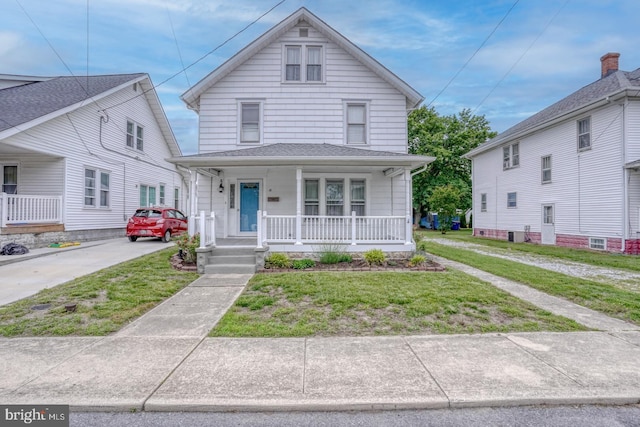 12 W Mispillion St, Harrington, DE 19952 - traditional style home featuring covered porch and a front lawn