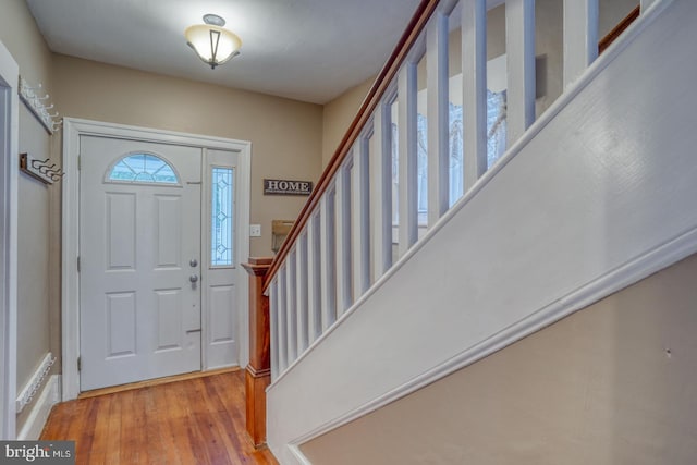 12 W Mispillion St, Harrington, DE 19952 - foyer entrance featuring stairs and wood finished floors