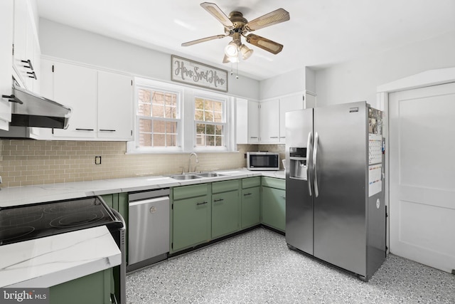 1614 Pine St, Norristown, PA 19401 - kitchen with stainless steel appliances, a sink, green cabinets, under cabinet range hood, and ceiling fan