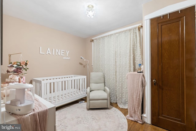 1614 Pine St, Norristown, PA 19401 - bedroom with wood finished floors and a nursery area