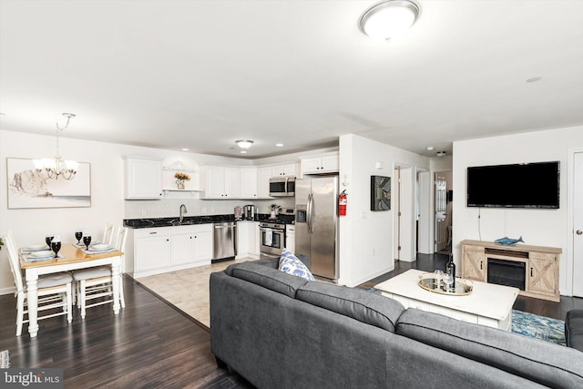 2033 Rte 35 N Unit B- N, Seaside Heights, NJ 08751 - living area with a chandelier, dark wood finished floors, baseboards, and recessed lighting