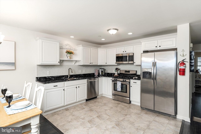 2033 Rte 35 N Unit B- N, Seaside Heights, NJ 08751 - kitchen featuring appliances with stainless steel finishes, a sink, open shelves, white cabinetry, and dark stone counters