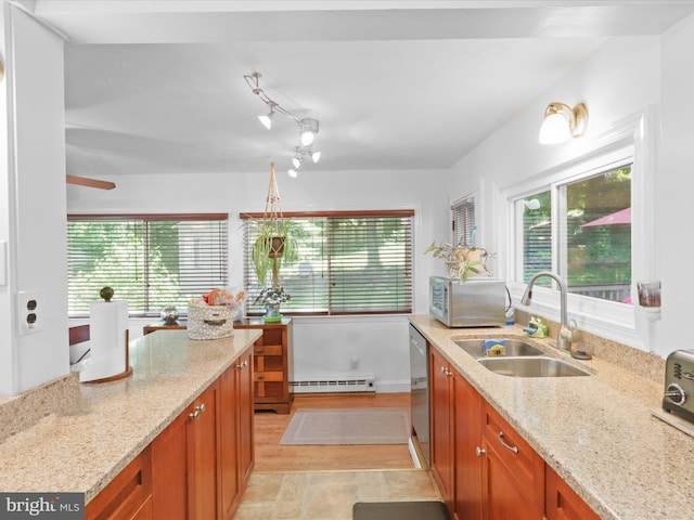 3912 13th St S, Arlington, VA 22204 - kitchen with a sink, a baseboard radiator, brown cabinetry, and light stone countertops