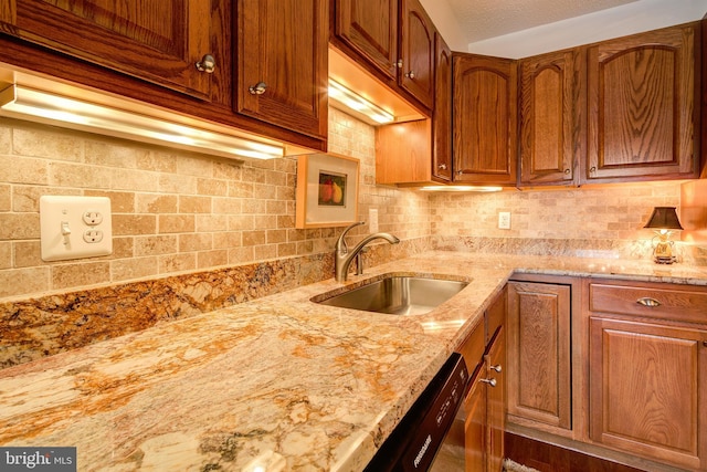 5904 Mount Eagle Dr Unit 1105, Alexandria, VA 22303 - kitchen with a sink, light stone countertops, backsplash, and brown cabinetry