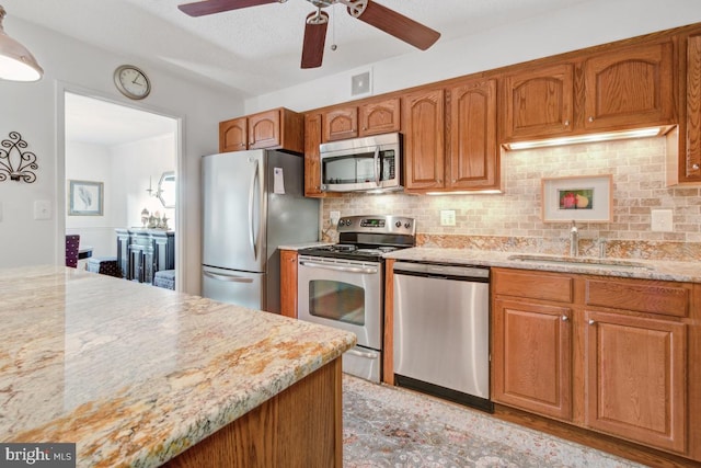 5904 Mount Eagle Dr Unit 1105, Alexandria, VA 22303 - kitchen featuring stainless steel appliances, a sink, ceiling fan, and backsplash