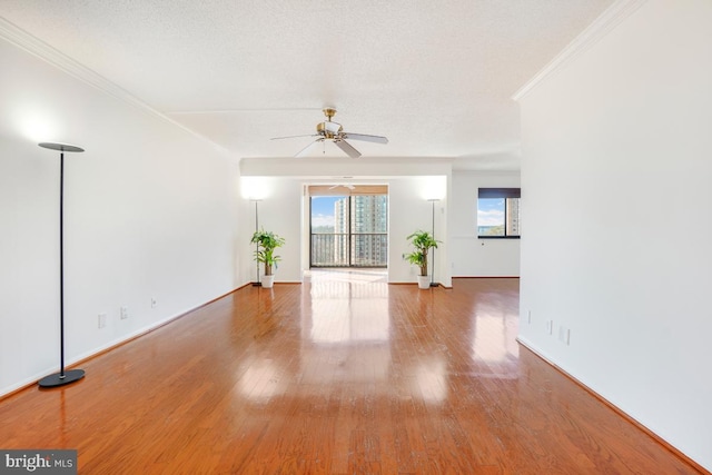 5904 Mount Eagle Dr Unit 1105, Alexandria, VA 22303 - unfurnished living room with ceiling fan, ornamental molding, wood finished floors, and baseboards