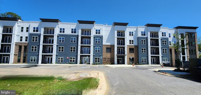76 Old Mill Bottom Rd N Unit 309, Annapolis, MD 21409 - view of building exterior with uncovered parking
