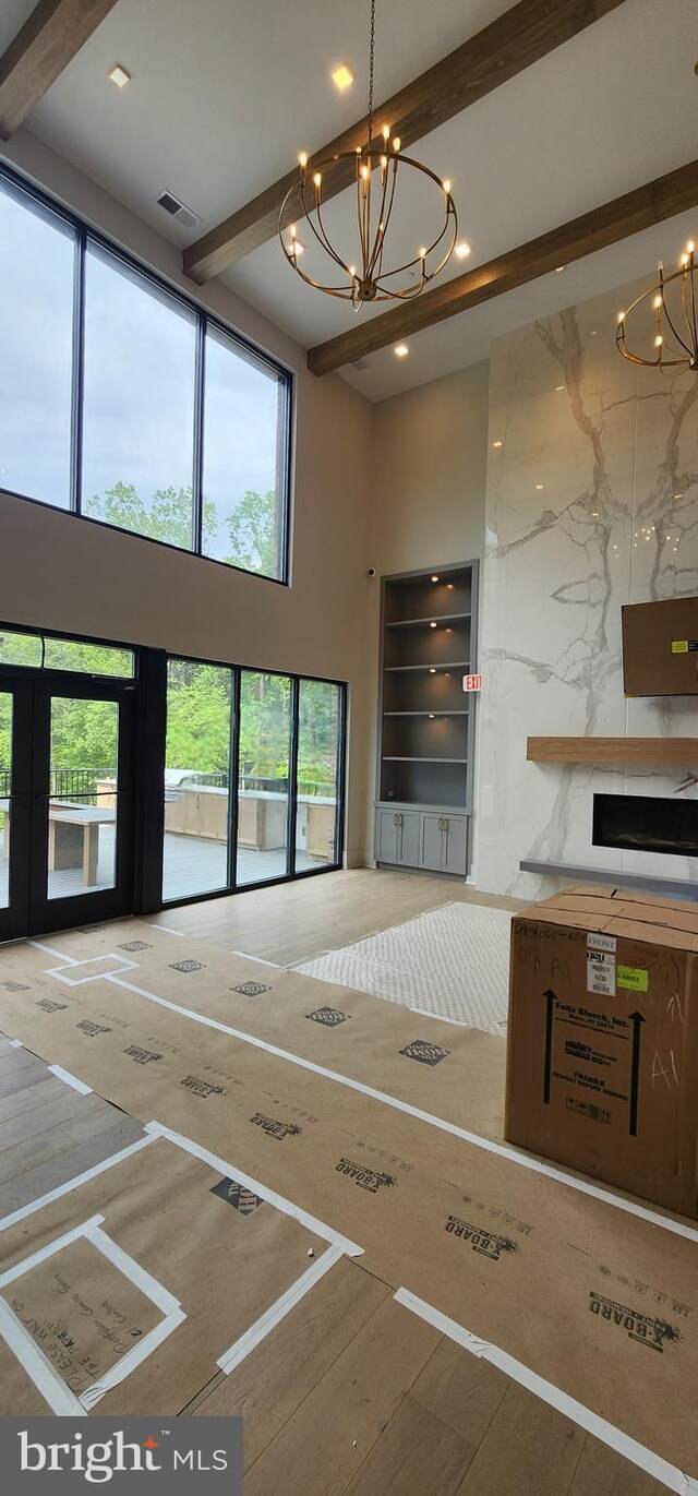 76 Old Mill Bottom Rd N Unit 309, Annapolis, MD 21409 - spare room featuring a chandelier, a towering ceiling, beam ceiling, and recessed lighting