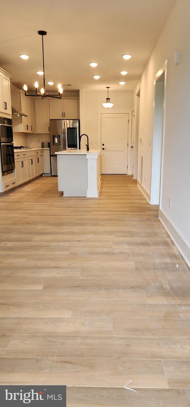 76 Old Mill Bottom Rd N Unit 309, Annapolis, MD 21409 - kitchen featuring appliances with stainless steel finishes, light wood finished floors, baseboards, recessed lighting, and pendant lighting