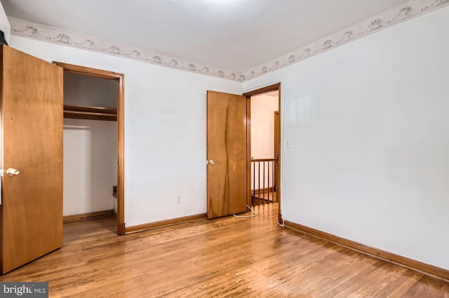 1210 Delbert Ave, Baltimore, MD 21222 - unfurnished bedroom featuring wood finished floors, baseboards, and a closet