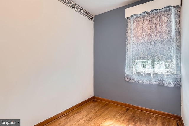 1210 Delbert Ave, Baltimore, MD 21222 - empty room with baseboards and wood finished floors