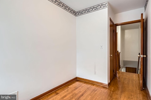 1210 Delbert Ave, Baltimore, MD 21222 - unfurnished room with wood finished floors and baseboards