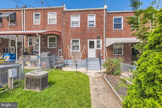 1210 Delbert Ave, Baltimore, MD 21222 - back of house featuring central air condition unit and brick siding