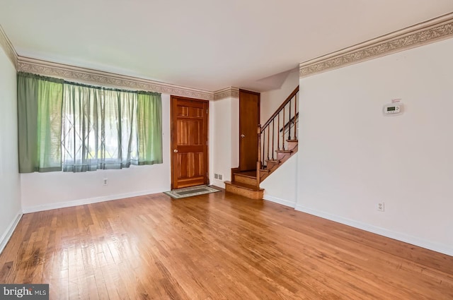 1210 Delbert Ave, Baltimore, MD 21222 - foyer featuring wood finished floors, stairway, and baseboards
