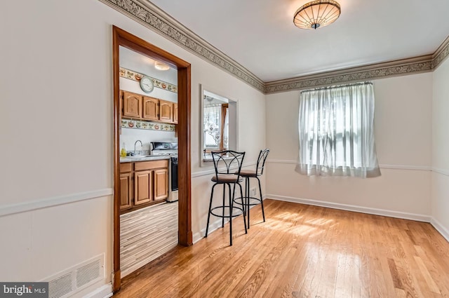 1210 Delbert Ave, Baltimore, MD 21222 - dining room with light wood-style floors and baseboards