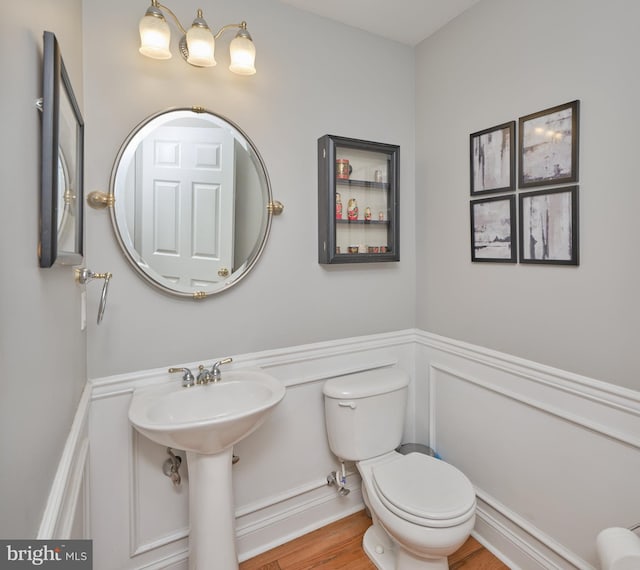 2056 Derbyshire Rd, Furlong, PA 18925 - bathroom featuring toilet, a wainscoted wall, a decorative wall, and wood finished floors