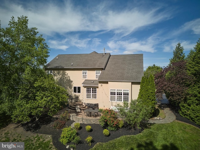 2056 Derbyshire Rd, Furlong, PA 18925 - rear view of house with a patio and a shingled roof