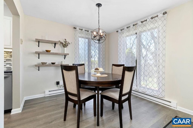 2070 Stone Rdg, Condos, Wintergreen, VA 22967 - dining space featuring a baseboard radiator, a chandelier, wood finished floors, and baseboards