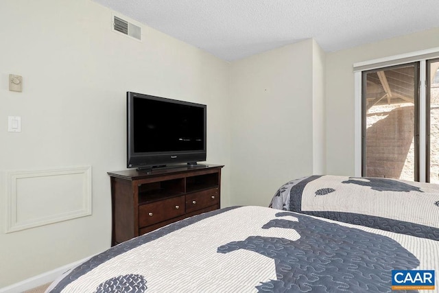 2070 Stone Rdg, Condos, Wintergreen, VA 22967 - bedroom featuring baseboards and a textured ceiling