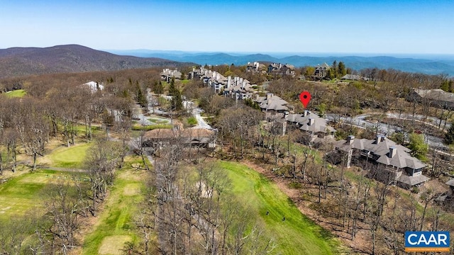 2070 Stone Rdg, Condos, Wintergreen, VA 22967 - aerial overview of property's location featuring a golf club, nearby suburban area, and a mountain backdrop