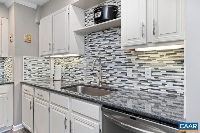 2070 Stone Rdg, Condos, Wintergreen, VA 22967 - kitchen with stainless steel dishwasher, a sink, white cabinets, backsplash, and ornamental molding