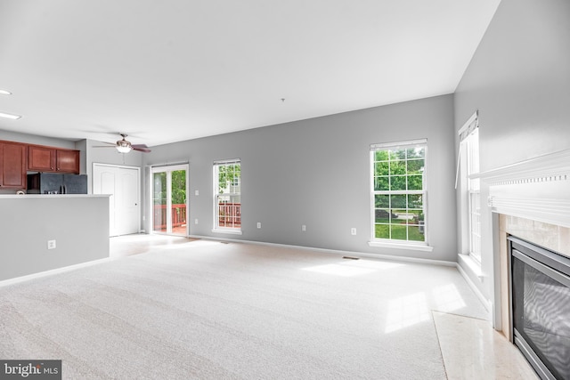 15626 Chadsey Ln, Brandywine, MD 20613 - unfurnished living room featuring a ceiling fan, light colored carpet, a high end fireplace, and baseboards