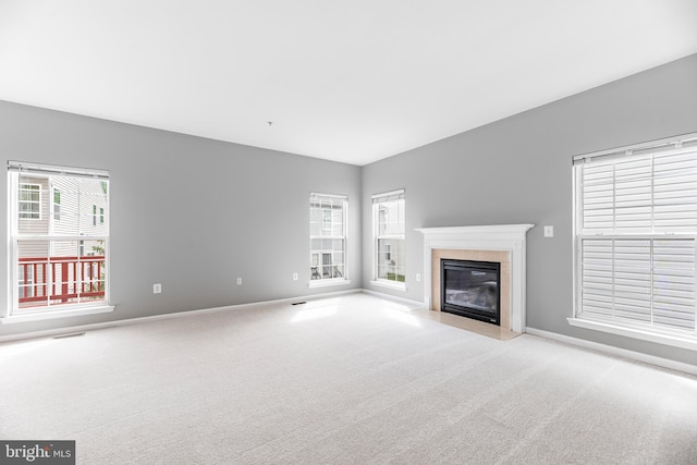 15626 Chadsey Ln, Brandywine, MD 20613 - unfurnished living room with carpet floors, a high end fireplace, healthy amount of natural light, and baseboards