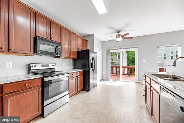 15626 Chadsey Ln, Brandywine, MD 20613 - kitchen with black appliances, a sink, ceiling fan, and brown cabinets