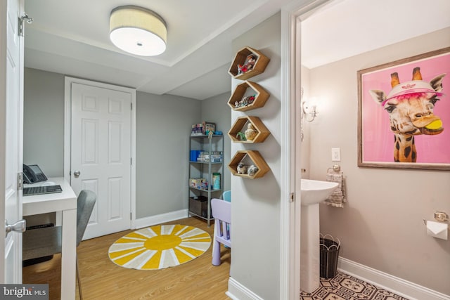 403 S Alder St, Philadelphia, PA 19147 - laundry room with wood finished floors, baseboards, and an office area