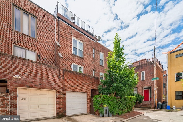 403 S Alder St, Philadelphia, PA 19147 - view of building exterior featuring a garage and driveway