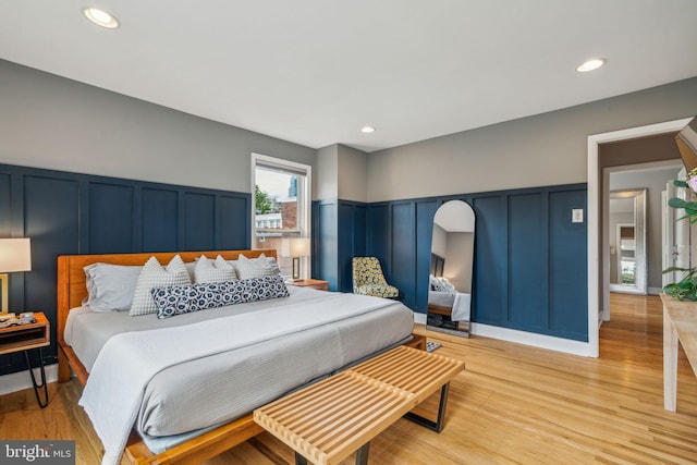 403 S Alder St, Philadelphia, PA 19147 - bedroom featuring a decorative wall, light wood-style flooring, wainscoting, and recessed lighting