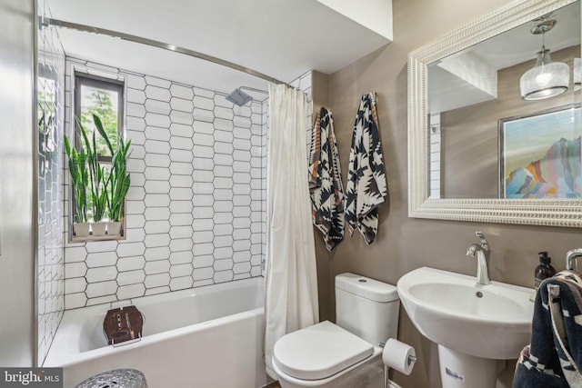 403 S Alder St, Philadelphia, PA 19147 - bathroom featuring shower / bath combo, toilet, and a sink