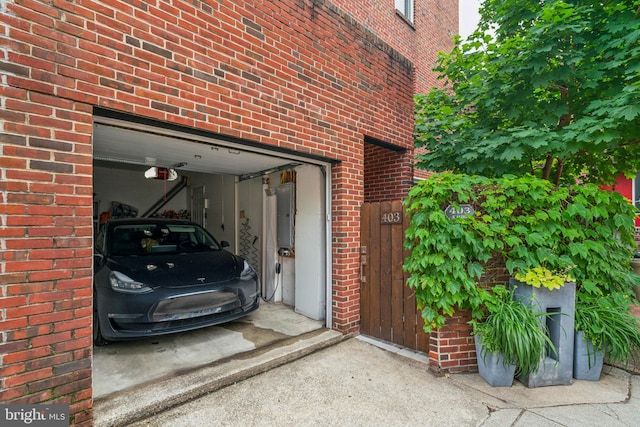 403 S Alder St, Philadelphia, PA 19147 - garage featuring a garage door opener and electric panel
