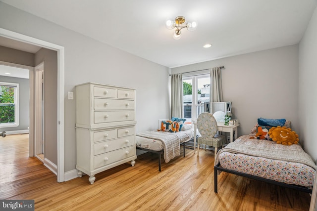 403 S Alder St, Philadelphia, PA 19147 - bedroom with multiple windows, light wood-style floors, baseboards, and recessed lighting