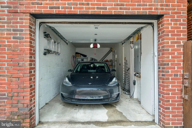 403 S Alder St, Philadelphia, PA 19147 - garage featuring a garage door opener and electric panel