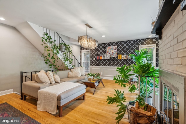 403 S Alder St, Philadelphia, PA 19147 - living room with an accent wall, wood finished floors, a chandelier, healthy amount of natural light, and recessed lighting