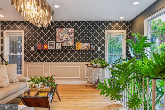 403 S Alder St, Philadelphia, PA 19147 - living area with wallpapered walls, wood finished floors, wainscoting, and recessed lighting