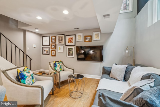 403 S Alder St, Philadelphia, PA 19147 - living area featuring wood finished floors, stairway, baseboards, and recessed lighting