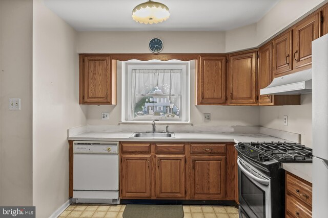 2428 Pliner Ct, Atco, NJ 08004 - kitchen with stainless steel range with gas stovetop, white dishwasher, a sink, under cabinet range hood, and light countertops