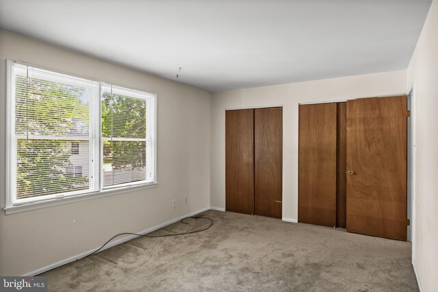 2428 Pliner Ct, Atco, NJ 08004 - unfurnished bedroom with multiple closets, multiple windows, carpet, and baseboards