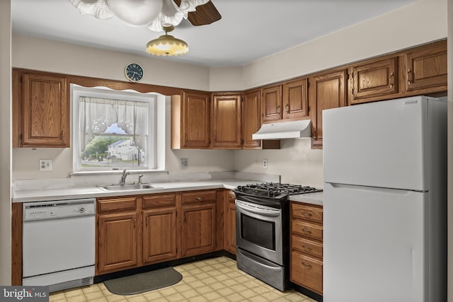 2428 Pliner Ct, Atco, NJ 08004 - kitchen with white appliances, a sink, under cabinet range hood, light countertops, and brown cabinetry