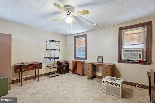 office with radiator, cooling unit, baseboards, a ceiling fan, and a textured ceiling