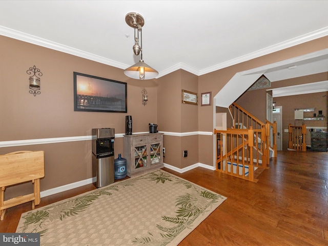 5500 Upshur Sq, Frederick, MD 21703 - living area with wood finished floors, baseboards, stairs, and ornamental molding
