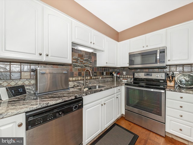 5500 Upshur Sq, Frederick, MD 21703 - kitchen featuring stainless steel appliances, a sink, white cabinetry, and decorative backsplash