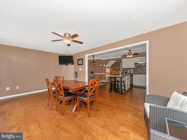 5500 Upshur Sq, Frederick, MD 21703 - dining space with ceiling fan, light wood-style flooring, stairway, and baseboards