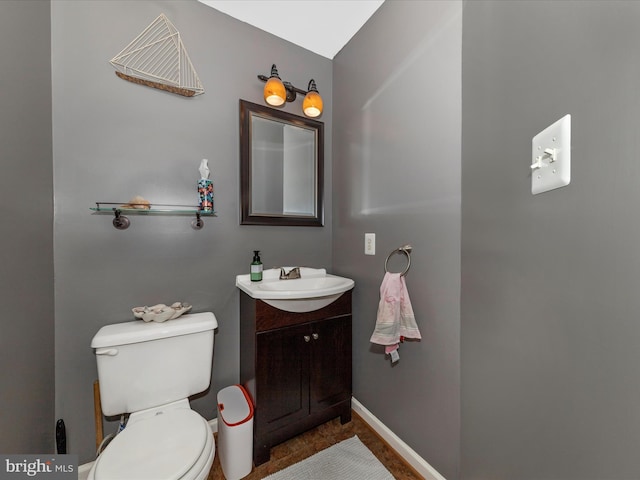 5500 Upshur Sq, Frederick, MD 21703 - half bathroom featuring vanity, toilet, and baseboards