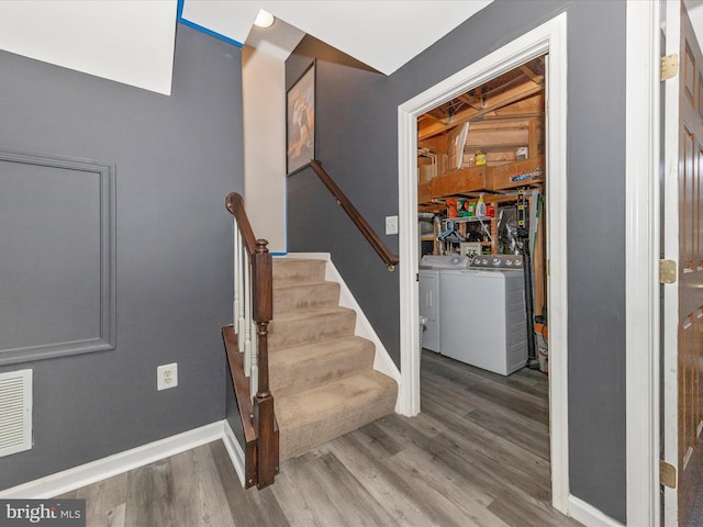 5500 Upshur Sq, Frederick, MD 21703 - stairway with wood finished floors, baseboards, and independent washer and dryer