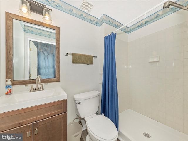 5500 Upshur Sq, Frederick, MD 21703 - bathroom with toilet, vanity, and a tile shower